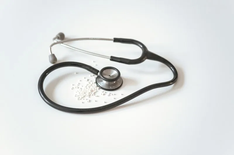 Medical stethoscope on clinic desk symbolizing professional NHS sexual health consultation