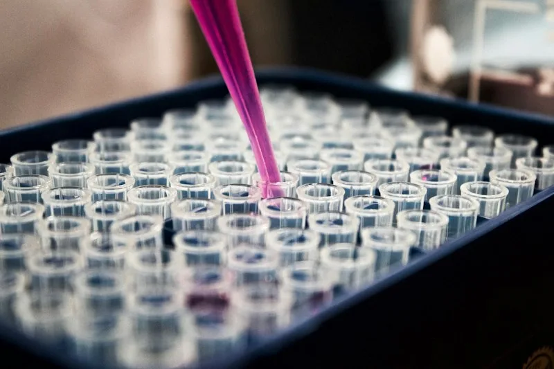 Clinical laboratory micro-titre testing plate demonstrating virological scientific research